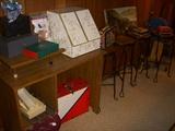 Work table/desk, Misc. boxes.  To the right:  Set of 4 Ice Cream stools in nice condition
