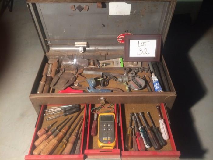 Metal tool box with key. Included are assorted tools seen in the pictures. Multimeter works. Items are in fair condition.