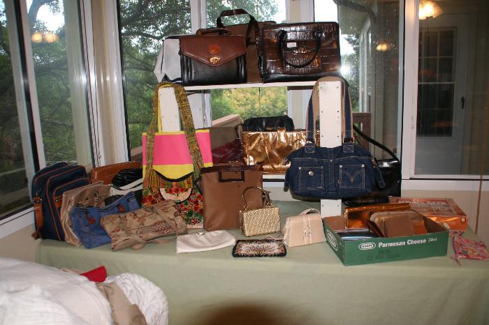 Lots of purses, wallets, clutches