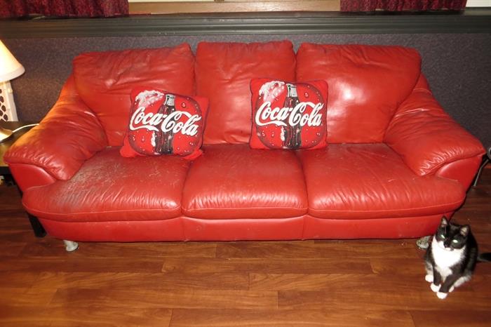 Red leather couch, loveseat and club chair.