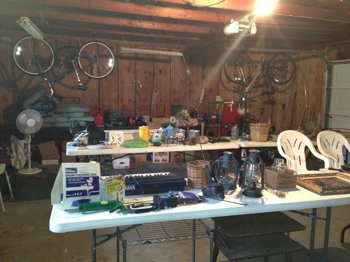 Leaf blower, 8" grinder, piano keyboard, plumbing supplies, two electric drills, electric cords, gas lanterns, metal plant stand