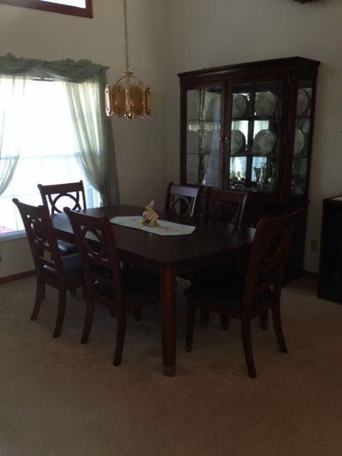 Dining table, 6 chairs and hutch.  All in pristine condition
