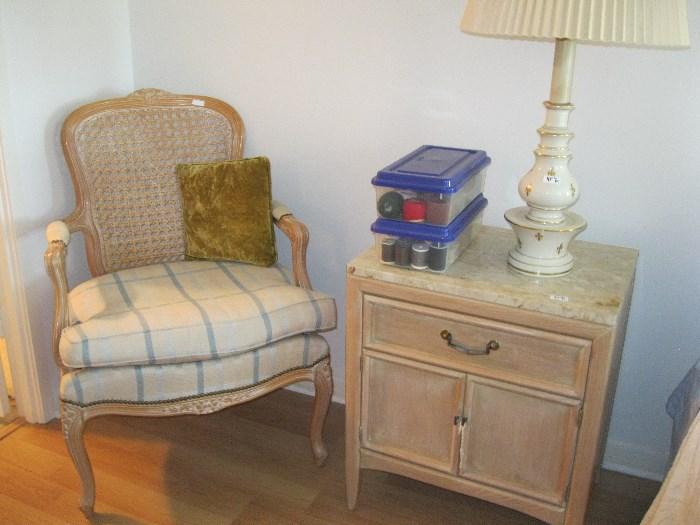 The other cain back chair and marble top side table