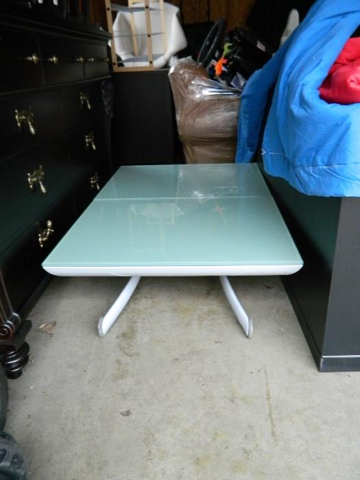 Glass and metal conversion coffee table, rises to make it higher
