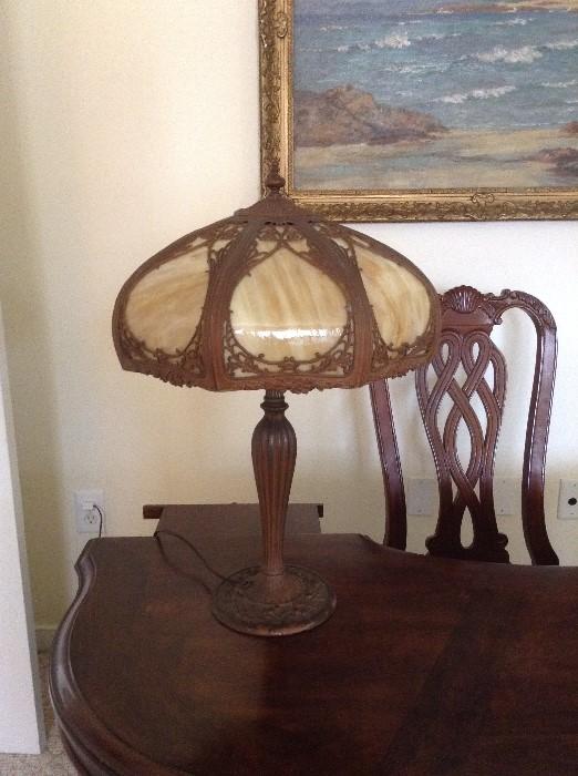 Antique slag glass lamp signed under base
