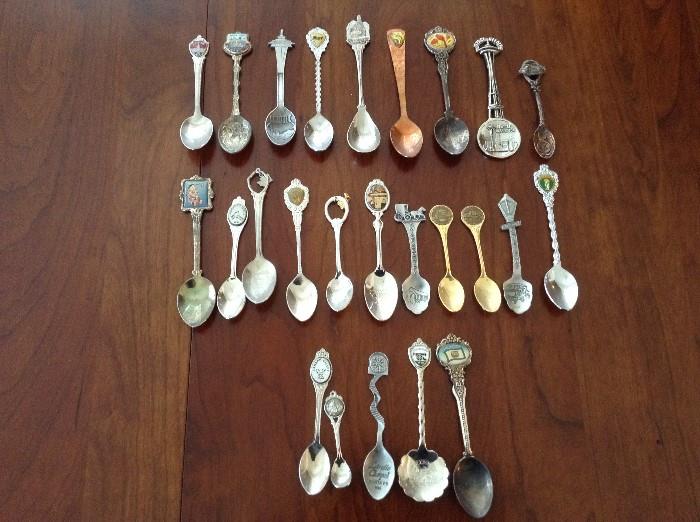large souvenir spoon collection representing years of travel