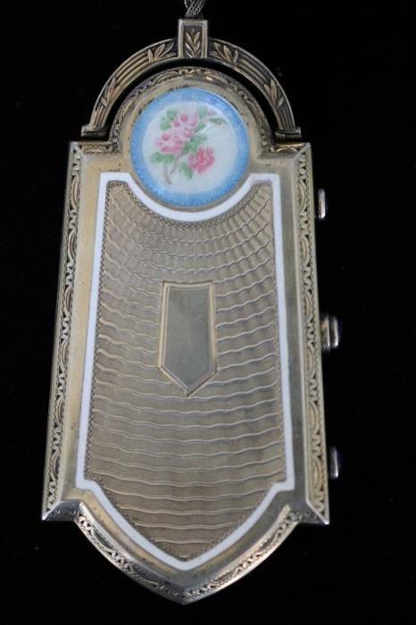 1920s Foster and Bailey sterling silver and enamel hinged compact with amethyst cabochon fasteners.