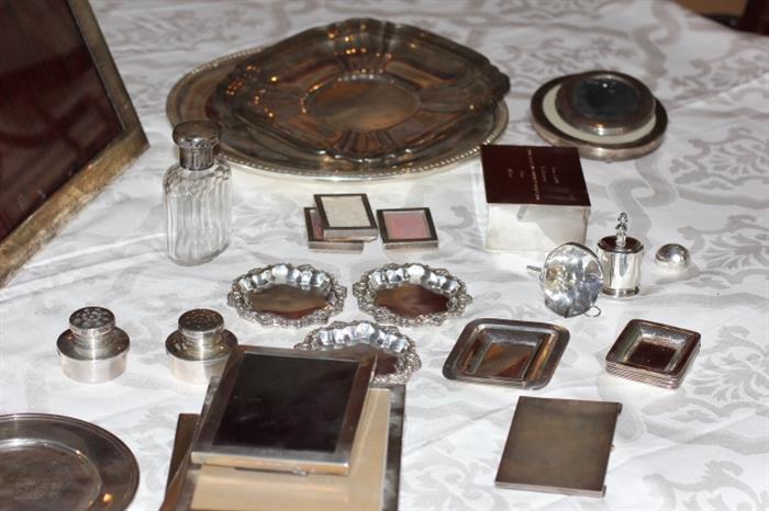 Nice assortment of sterling silver items, including sterling frames and other sterling smalls. Two nice-sized sterling trays, too.