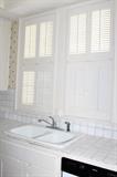 service kitchen from original house shutters, sink counter tops cabinets 