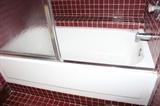 bath tub with sliding shower glass doors