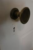 original 1920's solid wood door with door knob and key hole