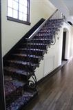 original staircase with rod iron and oak banister