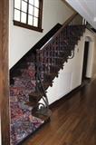 original staircase with rod iron and oak banister