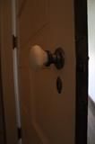 original 1920's solid wood door with door knob and key hole