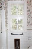 original 1920's window with shutters and radiator grates