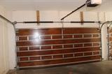 mahogany hurricane rated double garage doors with openers set of two 
