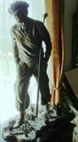 Bronze sculpture of golfer "A Good Walk Spoiled" by Richard Stravitz