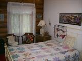 OVERVIEW OF BEDROOM W/IRON BED, QUILT, COMMODE, AND MORE!!