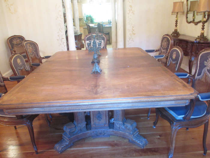 ANTIQUE DINING ROOM TABLE WITH TWO LEAVES AND PADS AND 8 CHAIRS