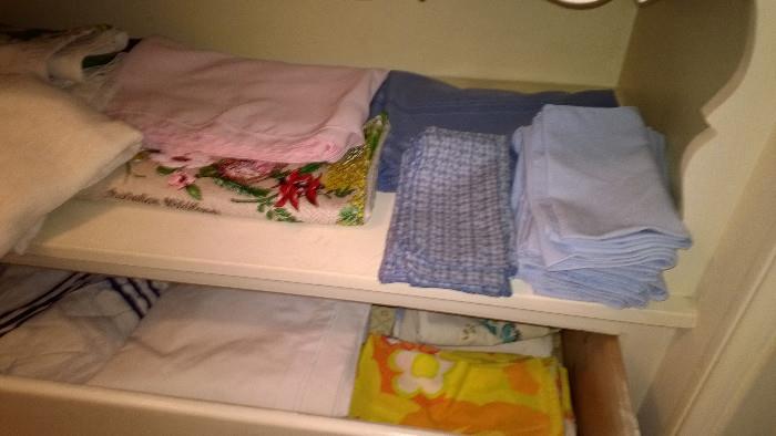 Beautiful linens including tablecloths, napkins, sheets