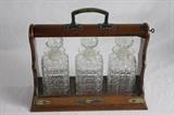 ANTIQUE TANTALUS DECANTER SET