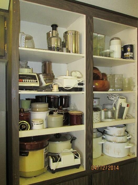 Tons of miscellaneous kitchen, crock pots, pots and pans