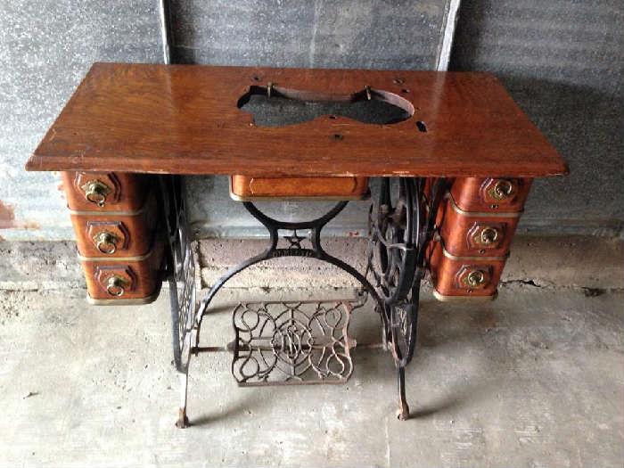 sewing machine table, just place a piece of glass on top and it will make a beautiful desk