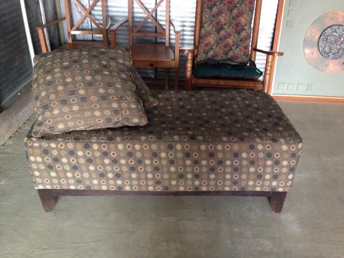 ottoman with two matching throw pillows.  the slip cover removes and there is another pattern underneath
