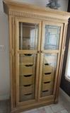 Most unusual tall chest with glass insert doors.