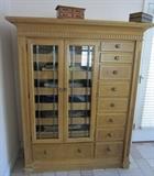 Chest that matches tall chest.  Glass doors and side drawers.
