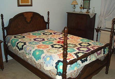 Full size bed, dresser, quilt, quilt rack