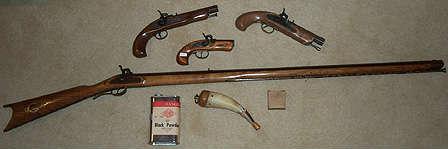 1960's (?) Black powder pistols and long rifle, powder horn, balls and powder