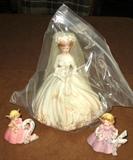 Example of 16 total Josef birthday cake porcelain dolls plus bride