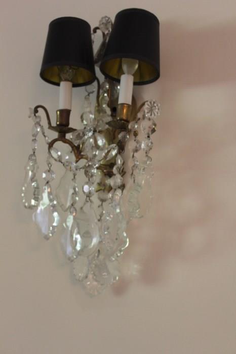 A beautifull pair of sconces with black shades.