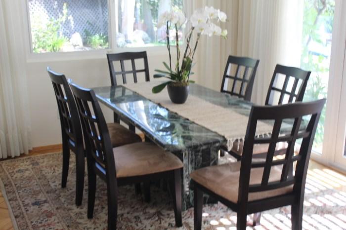 Table with 6 chairs. The table is Marble and Beautiful!