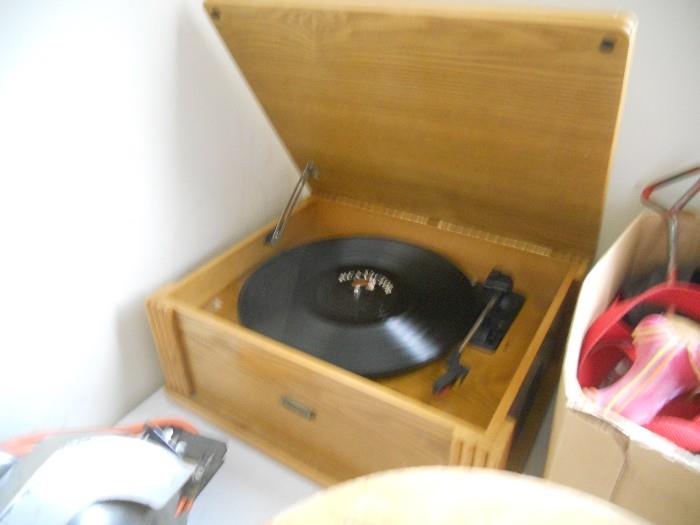 Record player with so many vinyls to choose from.  We also have 45's.
