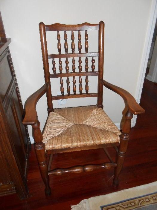 One of two arm chairs w/drop leaf dining room table