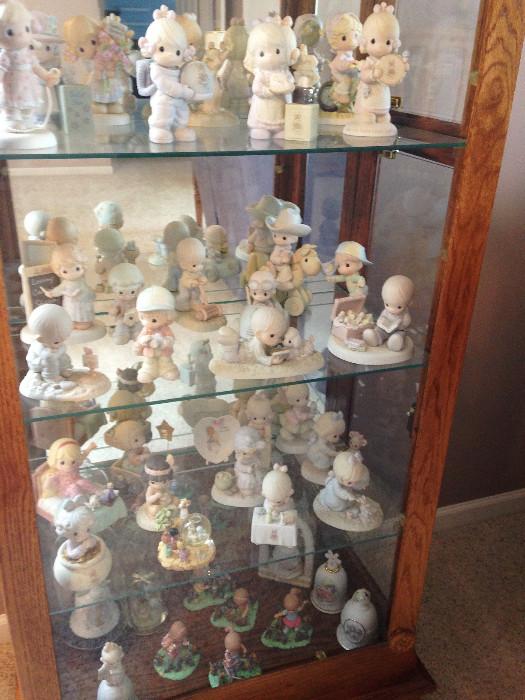 Precious Moments Figurines Collection: PM851, 12262, PM902, 100072, Plate A931, PM932, 1976 Prayer Changes Things, C0022, C0011, 1981 Porcelain Bisque Ad Plaque, PM972, E0005, PM982, PM951, PM922, E3109, C0016, C0015, PM861, PM961, PM921, PM892, PM872, C0018, PM852, PM981, PM992, PM901, PM971, E0530, C0012, C0024, C0013, E0006, C0020, 1991 Mailbox #898945, PM891, PM991, CC990001, C0014, C0019, PM912, Snow Globe 2000 Nativity, 1994 Tiny Heart-shaped Plate, PM952, C0010, PM881, E0007, PM941, PM962, 603171 '94 Bell, 2000 Bell, 1999 Bells, S27726 Bell, and Furry Best Friend Pieces (I'll Always Return to You, Best Friends Take the Lead, Friendship Hits the Spot, Furry Best Friend, & Friends Are Splashin' Good Fun)