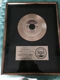 Donna Summers golden record for selling over a million records of "Heaven Knows"