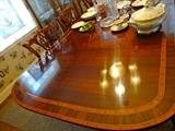 in laid dining room table with three pedestals and three leaves.  and 14 chairs