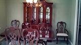 Beautiful cherry lighted hutch and cherry dining table with 2 leaves and six chairs. All in pristine condition