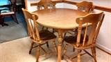Maple kitchen table with one insert formica top. Six matching chairs.1960's