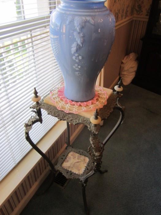 Antique umbrella vase on brass table