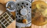 Antique handmade fishing lures and antique fishing reel.