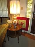 Leather top table and gold glass lamp; needlepoint 