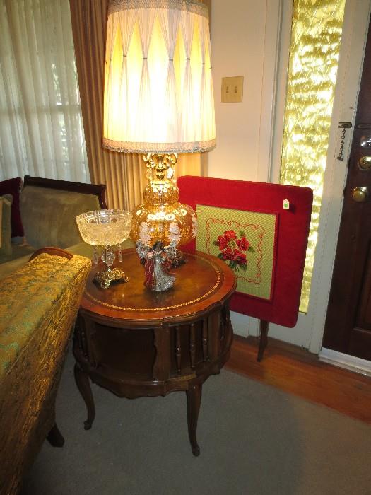 Leather top table and gold glass lamp; needlepoint 