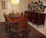 French dining room set, table with fancy inlays, 6 chairs, bombe sideboard, wall mirror, and blind china cabinet. Amazing condition! You want quality that will make a statement in your home or shop? Here it is!
