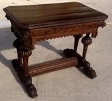 Antique French desk, ornately carved with lion heads on all 4 corners