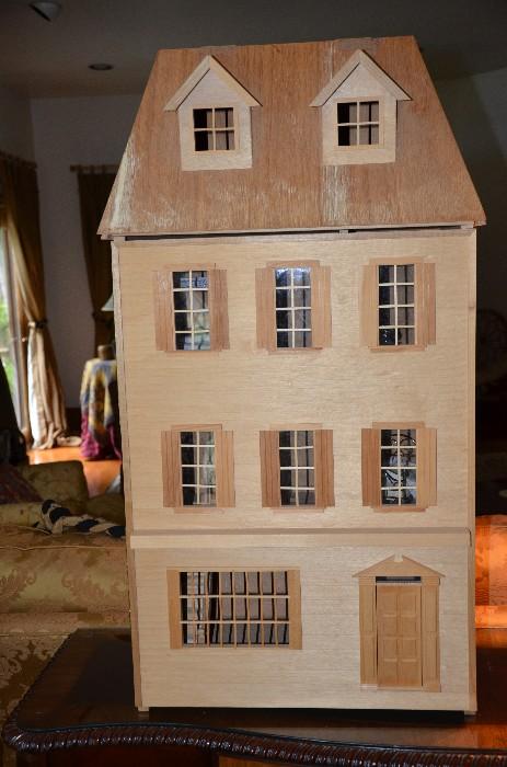 Begin a new hobby with this all balsa wood London townhouse. 39.5"Hx20.5wx13d. Paint the exterior, add lighting to glow through the windows, needle point rugs for the floors. Yours to design in whatever way you wish. $150 firm. It's a dream home.