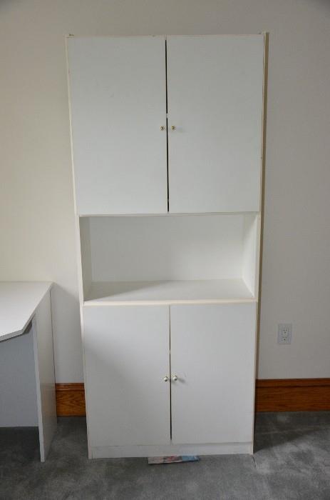 White cabinet. One moveable shelf both lower and upper. Nice for girl's room or dorm room. Simple lines but very sturdy. 30"w x 6ft h x 13"d. $40.00